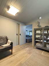 Living area featuring vaulted ceiling and wood finished floors