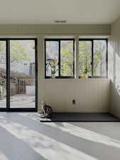 Unfurnished sunroom featuring visible vents