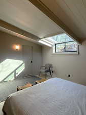 Bedroom featuring lofted ceiling