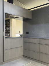 Kitchen featuring finished concrete flooring