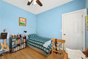 Bedroom featuring ceiling fan and wood finished floors