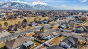 Birds eye view of property featuring a mountain view and a residential view