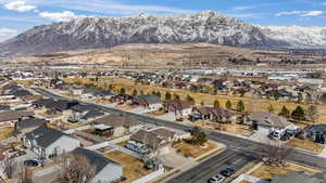 Birds eye view of property with a residential view and a mountain view