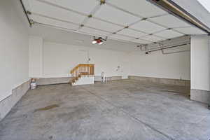 Garage with a sink and a garage door opener