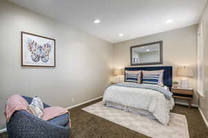 Bedroom with carpet, baseboards, and recessed lighting