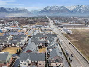 Birds eye view of property with a residential view and a mountain view