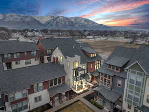 Aerial view at dusk with a residential view and a mountain view