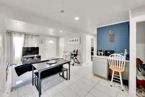 Dining space featuring recessed lighting