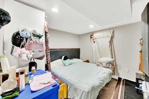 Bedroom featuring baseboards and recessed lighting