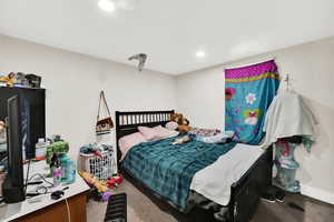 Bedroom with recessed lighting, carpet flooring, and baseboards