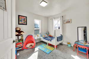 Bedroom with carpet floors and baseboards