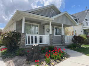 Bungalow-style home featuring covered porch