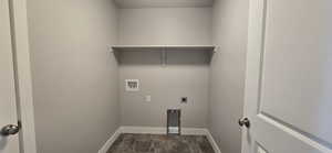 Laundry area featuring laundry area, hookup for an electric dryer, baseboards, and washer hookup