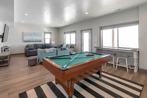 Rec room with light wood-style flooring, recessed lighting, billiards, visible vents, and baseboards