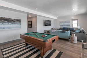 Playroom featuring light wood-style flooring, billiards, baseboards, and recessed lighting