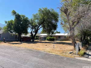 Ranch-style home with fence