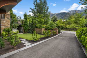 View of asphalt driveway with a mountain view and separate entrance for guest or mother in law apt