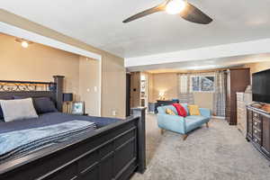 Bedroom featuring ceiling fan and light colored carpet