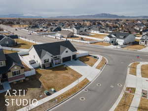 Birds eye view of property with a residential view and a mountain view