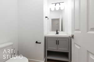 Bathroom featuring vanity and toilet