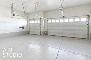 Garage featuring a garage door opener