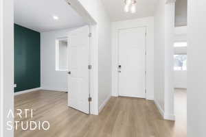 Entryway featuring light wood-style flooring and baseboards