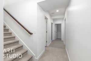 Stairs with carpet, visible vents, baseboards, and recessed lighting