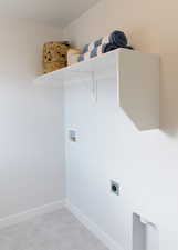 Washroom featuring washer hookup, laundry area, hookup for an electric dryer, and baseboards