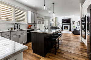 Kitchen with light quartzite countertops and lots of storage space and room to spread out