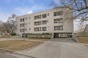 View of building exterior featuring driveway