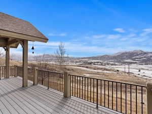 Wooden deck featuring a mountain view