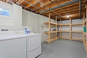Laundry area featuring laundry area and washing machine and dryer