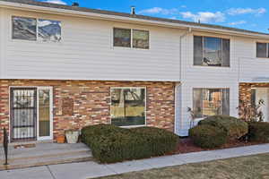 View of front of house featuring brick siding