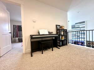 Living area with baseboards and carpet floors
