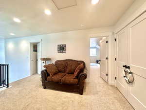 Carpeted living room featuring recessed lighting