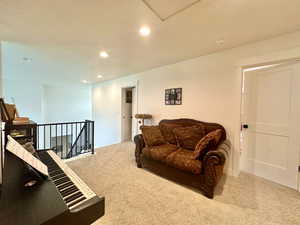 Living area featuring recessed lighting and carpet