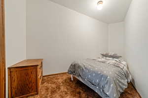 Carpeted bedroom with baseboards