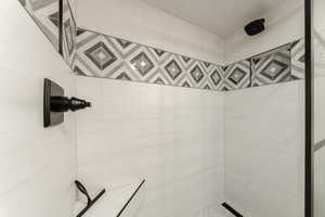 Full bathroom with a tile shower