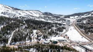 Snowy aerial view featuring a mountain view