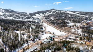 Snowy aerial view featuring a mountain view