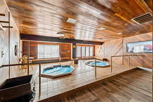 Pool featuring an indoor in ground hot tub