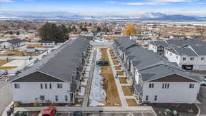 Drone / aerial view featuring a residential view and a mountain view