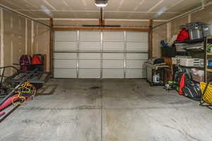 Garage featuring a garage door opener