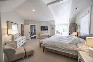 Bedroom featuring recessed lighting, visible vents, vaulted ceiling, and light carpet