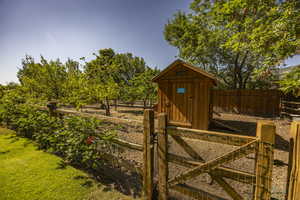 View of shed with a fenced backyard