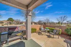 View of patio / terrace with grilling area and fence private yard