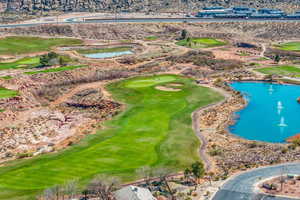 Bird's eye view with golf course view and a water view