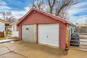 Detached garage with concrete driveway