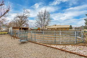 View of yard with an outdoor structure and an exterior structure