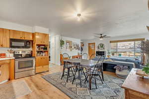 Dining space featuring light wood-type flooring and ceiling fan